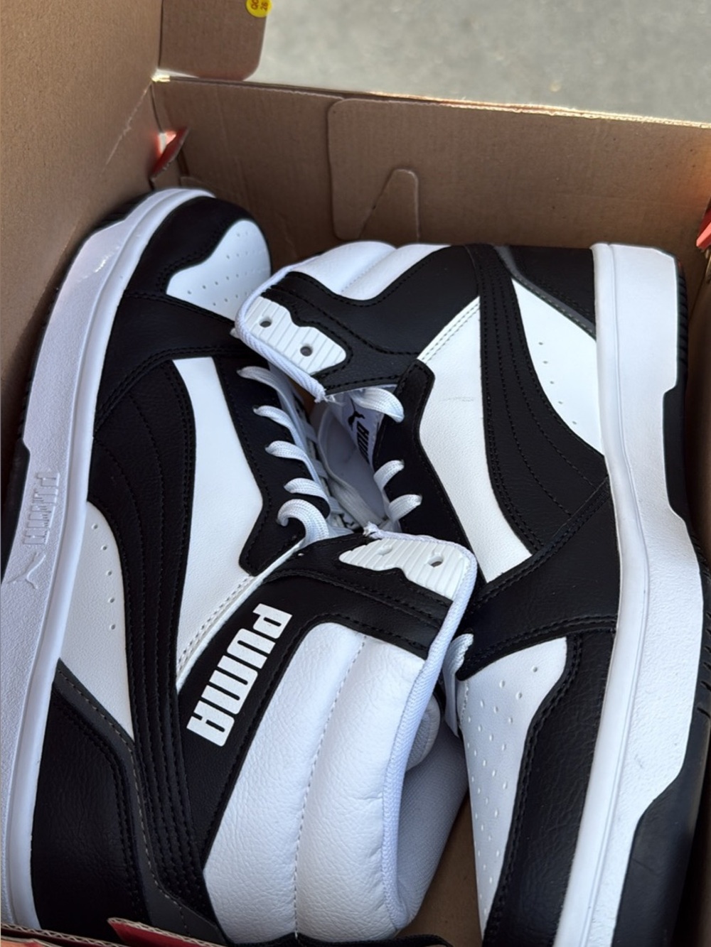 Puma Black and White Mid-Top Sneakers with Bold Branding